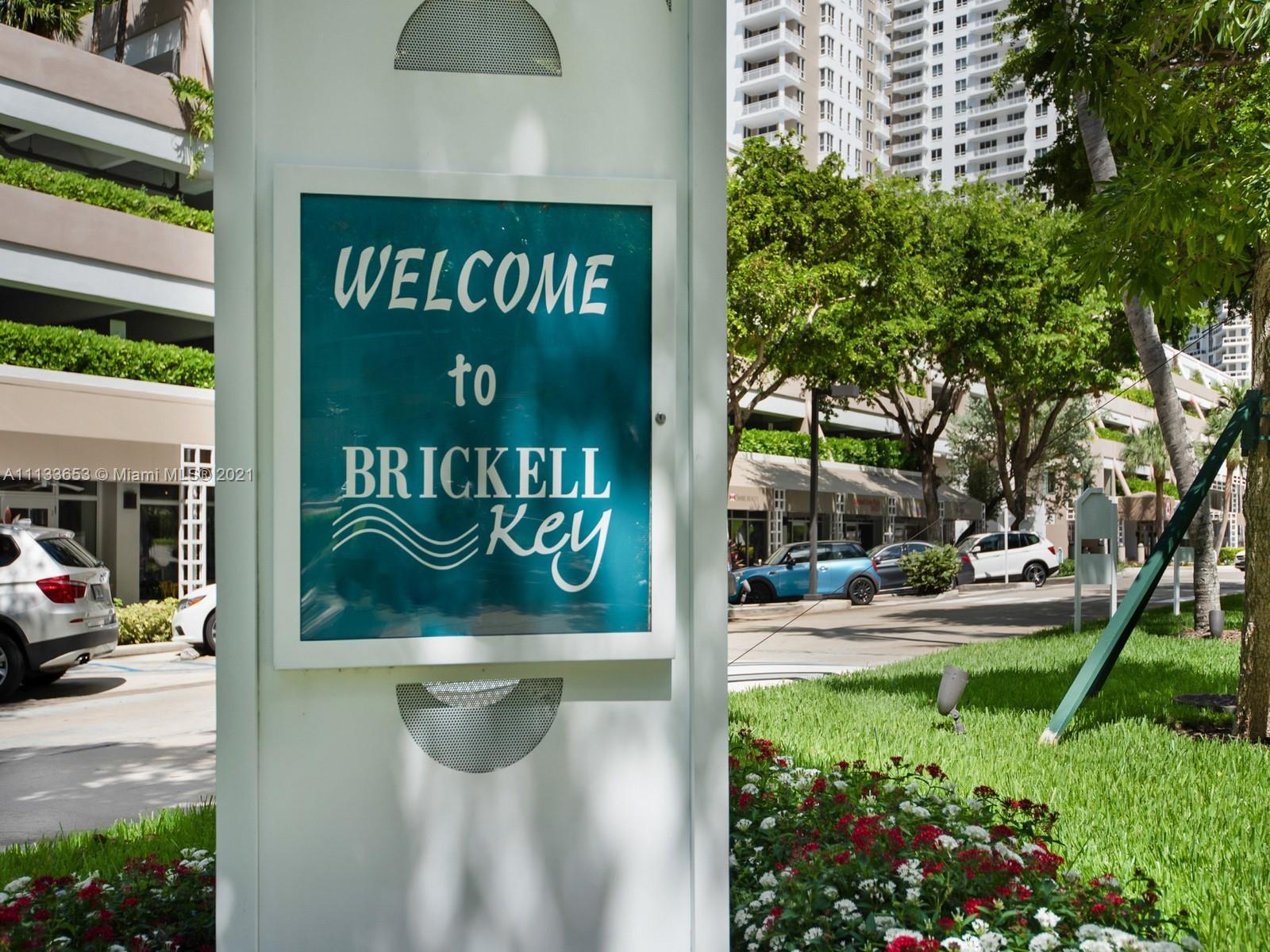 520 Brickell Key Drive, Unit A1815 Miami, FL 33131 - Photo 21 of 34 a sign that is sitting on a brick wall