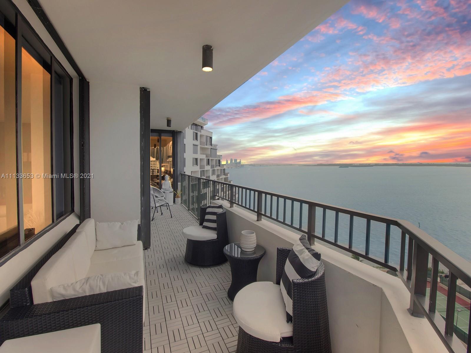 520 Brickell Key Drive, Unit A1815 Miami, FL 33131 - Photo 33 of 34 a view of a balcony dining table and chairs