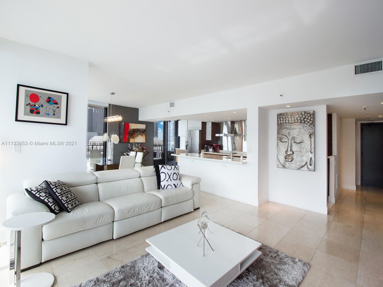 520 Brickell Key Drive, Unit A1815 Miami, FL 33131 - Photo 5 of 34 a living room with furniture and a rug