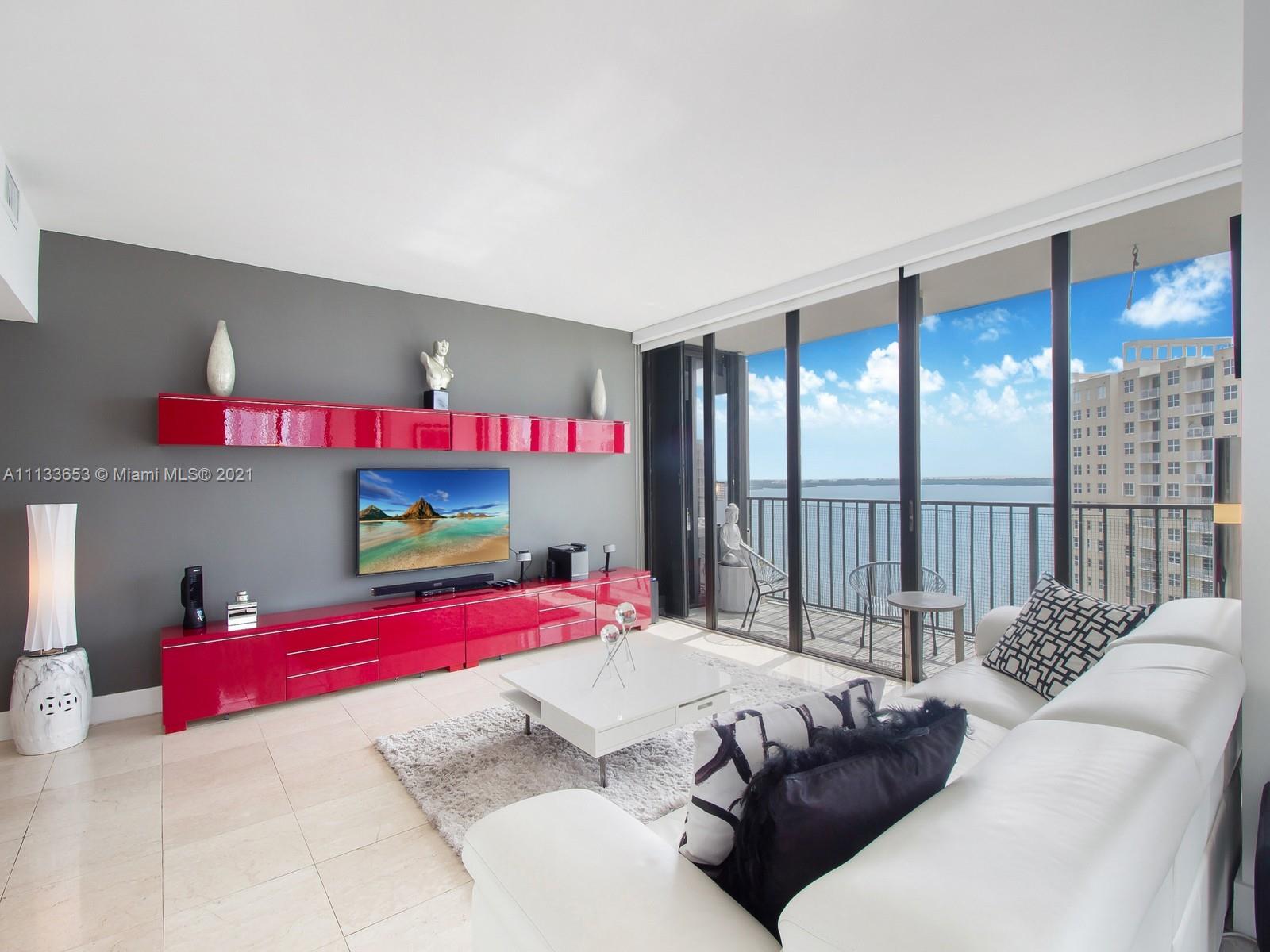 520 Brickell Key Drive, Unit A1815 Miami, FL 33131 - Photo 10 of 34 a bedroom with a bed and large window