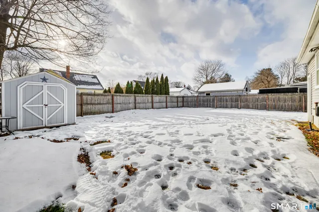 a view of a backyard of the house