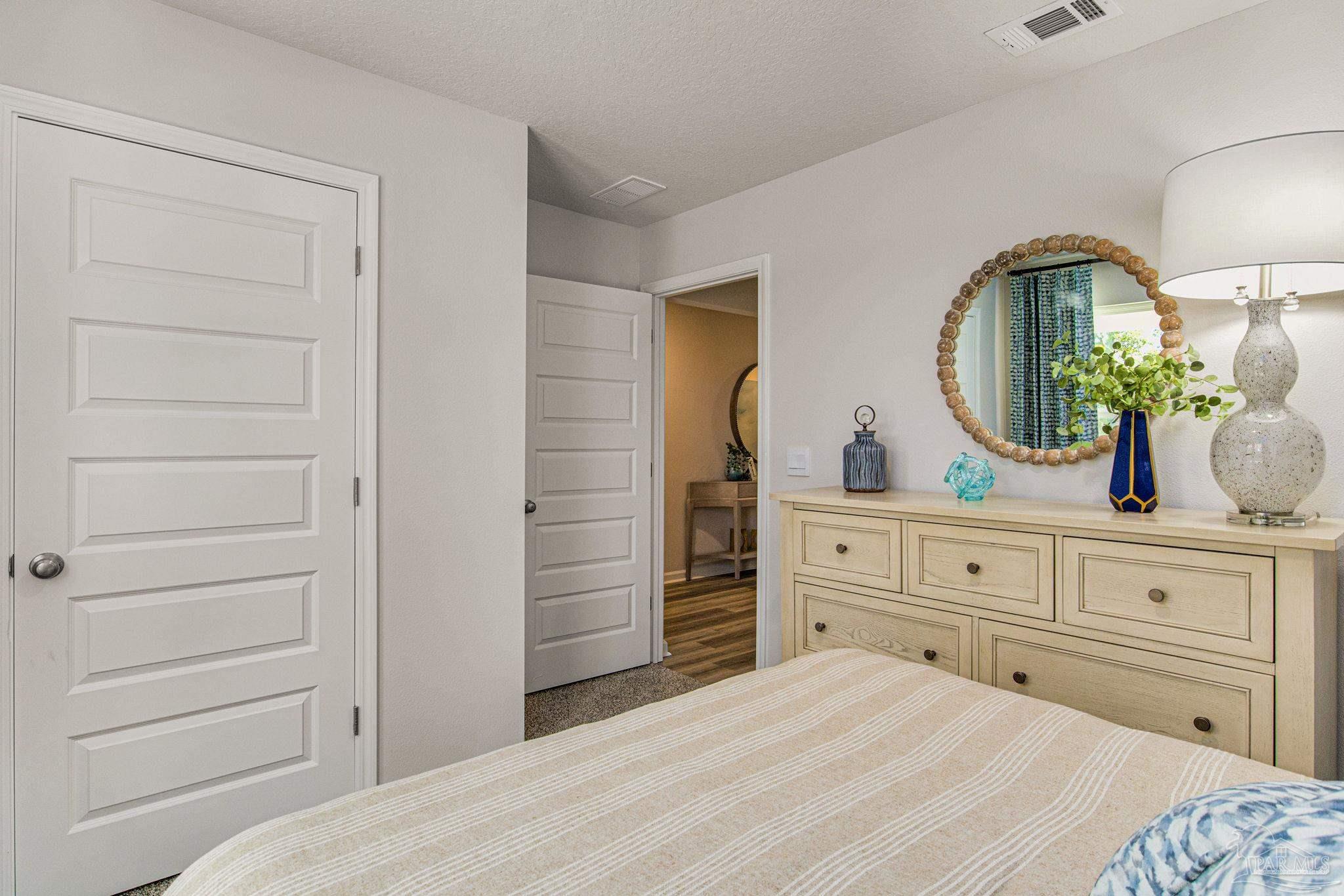 2103 Sandhill Street Cantonment, FL 32533 - Photo 23 of 30 a bedroom with a bed and a dresser