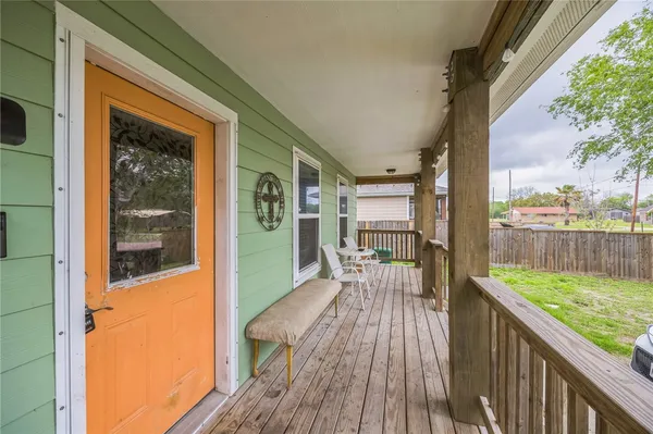 a balcony with wooden floor