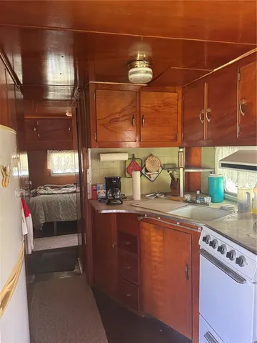 a kitchen with cabinets and window