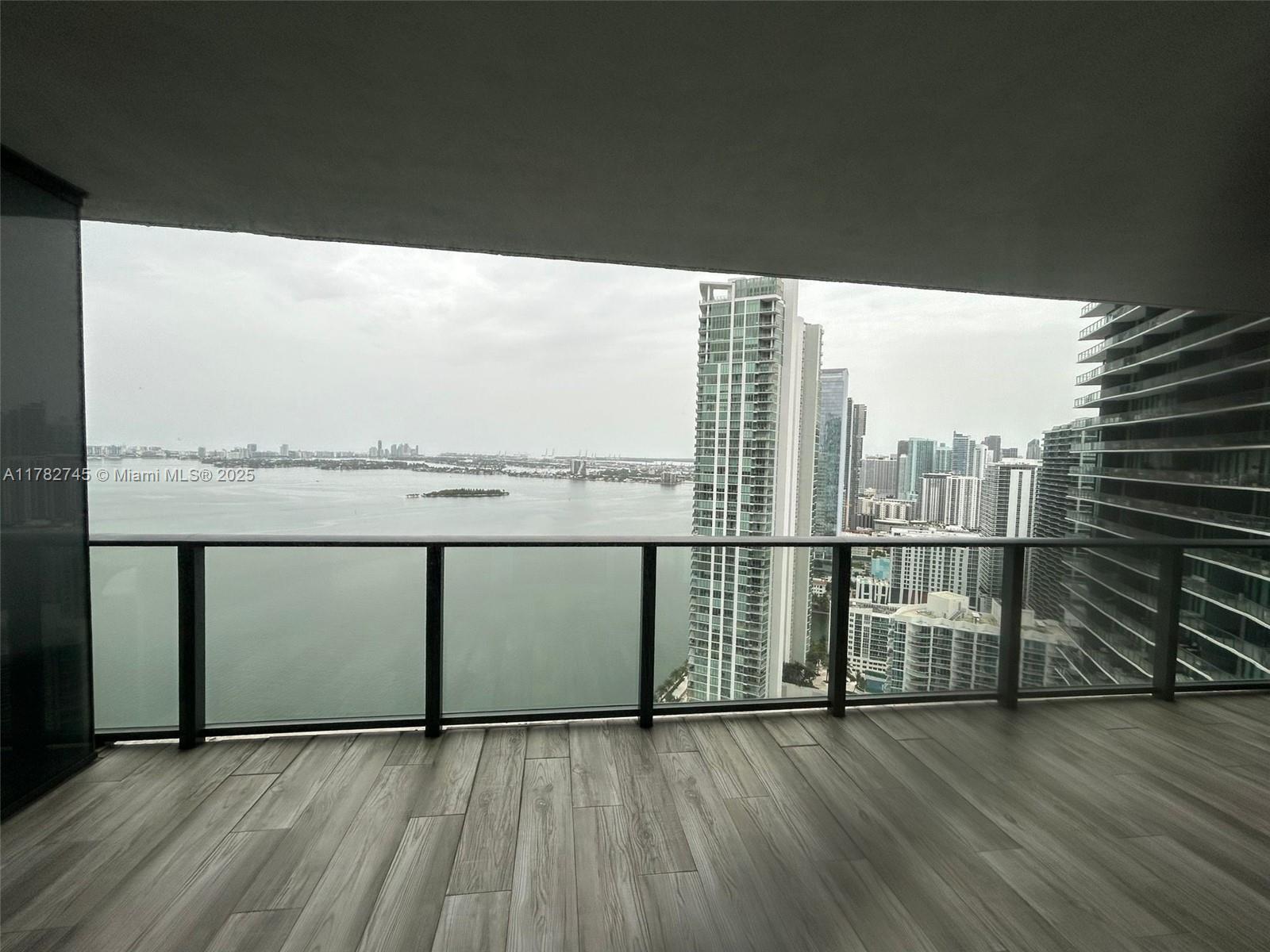 Edgewater Miami, FL 33137 - Photo 2 of 10 a view of a balcony with wooden floor