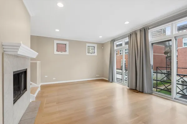 a view of livingroom with an empty space and a fireplace