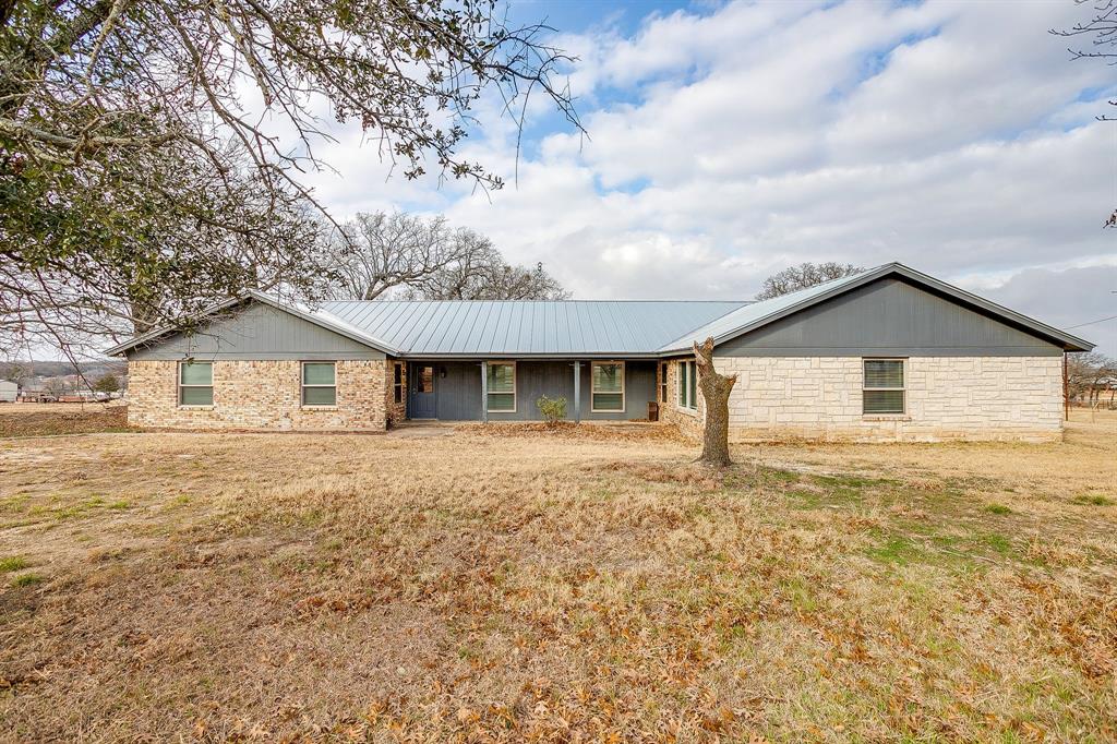 938 County Road 3341 Paradise, TX 76073 - Photo 14 of 40 a front view of house with yard and trees around