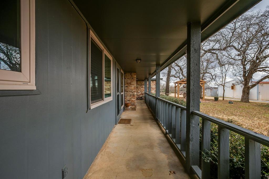 938 County Road 3341 Paradise, TX 76073 - Photo 16 of 40 a view of a balcony with wooden floor