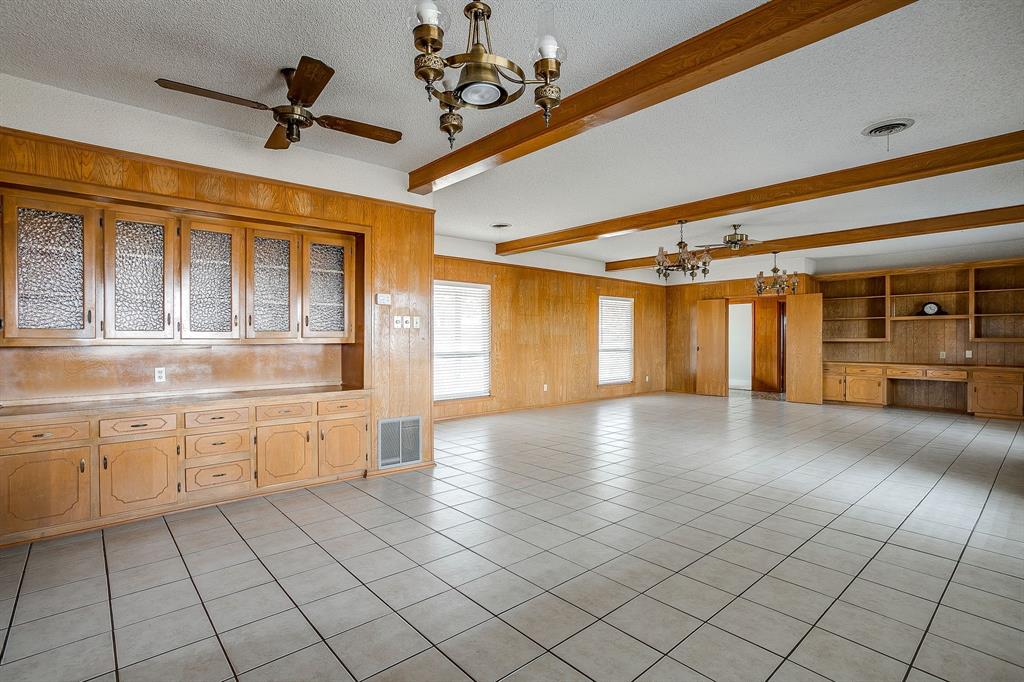 938 County Road 3341 Paradise, TX 76073 - Photo 21 of 40 a view of a livingroom with an entryway and a ceiling fan