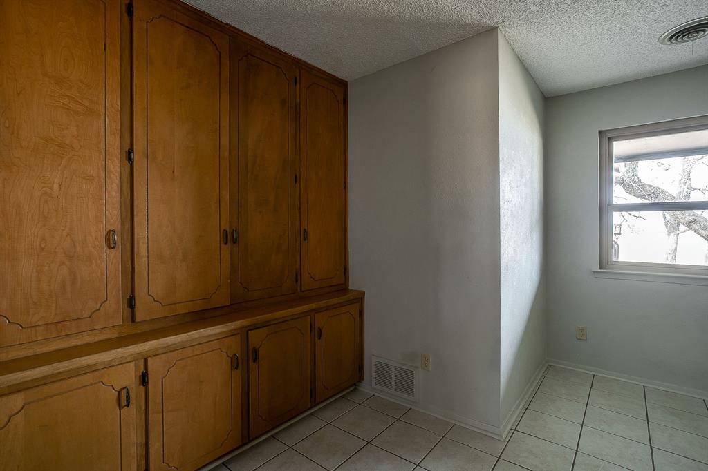 938 County Road 3341 Paradise, TX 76073 - Photo 33 of 40 a view of a closet area with wooden floor