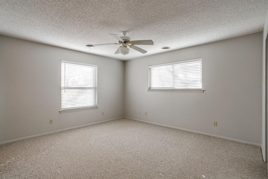 938 County Road 3341 Paradise, TX 76073 - Photo 34 of 40 an empty room with a window and a fan