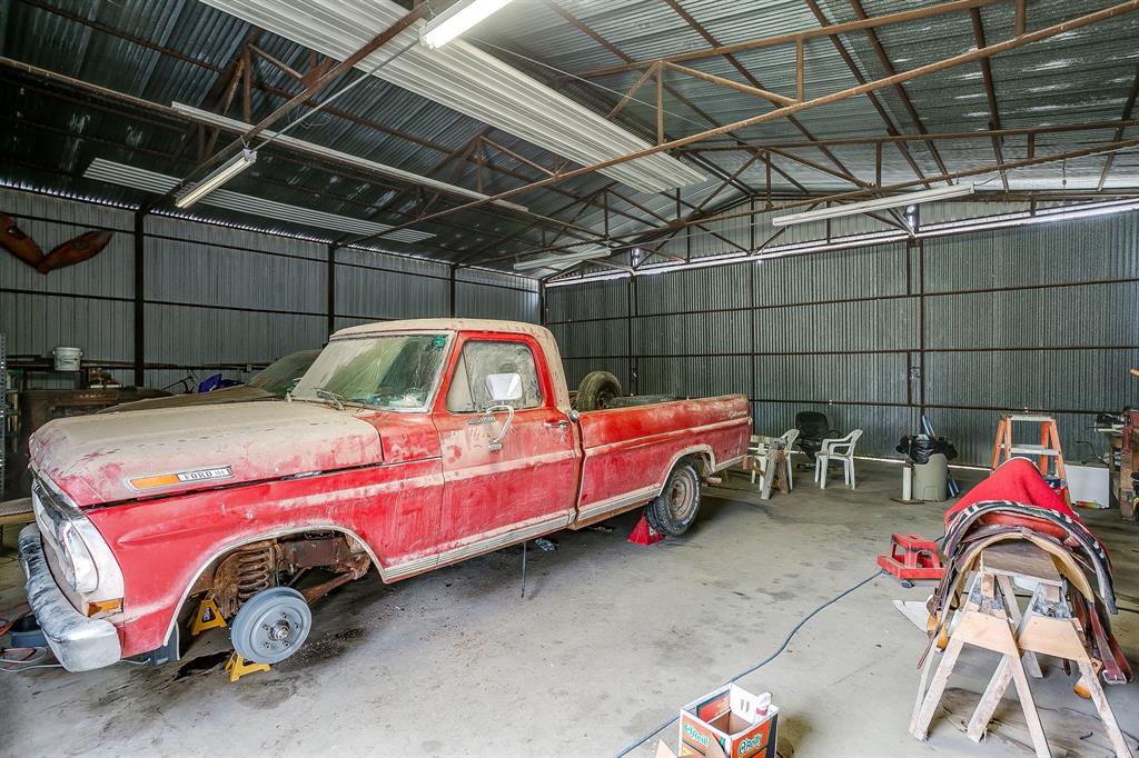 938 County Road 3341 Paradise, TX 76073 - Photo 39 of 40 a bedroom with a bed and a utility room