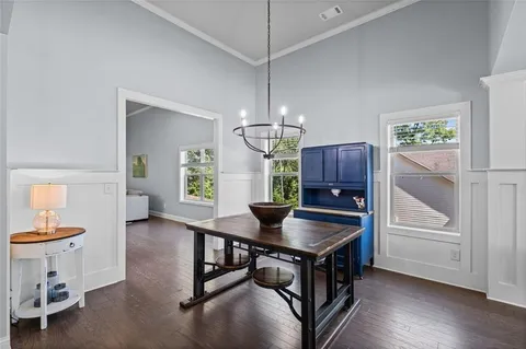 a kitchen that has a table and chairs in it