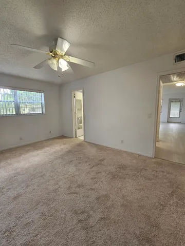 a view of an empty room with a window