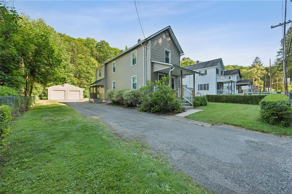 a front view of a house with a yard