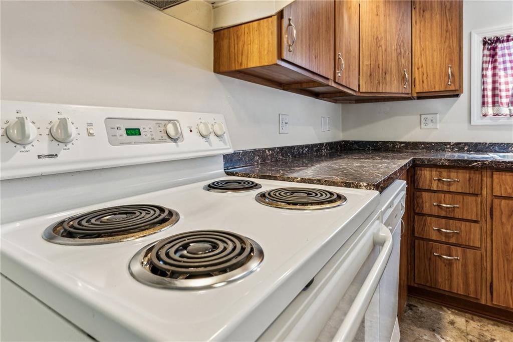 1746 Soap Hollow Road Johnstown, PA 15905 - Photo 14 of 30 a kitchen with a stove and a microwave