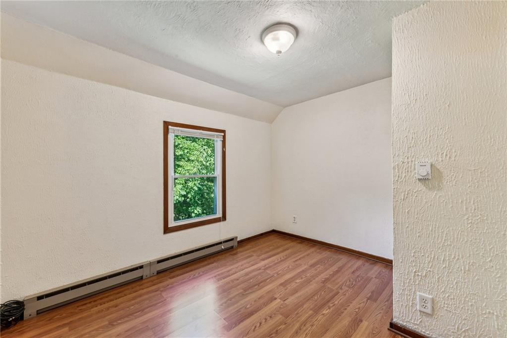1746 Soap Hollow Road Johnstown, PA 15905 - Photo 18 of 30 an empty room with wooden floor and windows