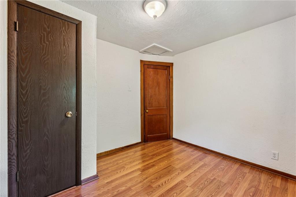 1746 Soap Hollow Road Johnstown, PA 15905 - Photo 19 of 30 a view of an empty room with wooden floor and closet