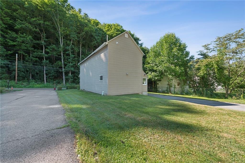 1746 Soap Hollow Road Johnstown, PA 15905 - Photo 27 of 30 a backyard of a house with lots of green space