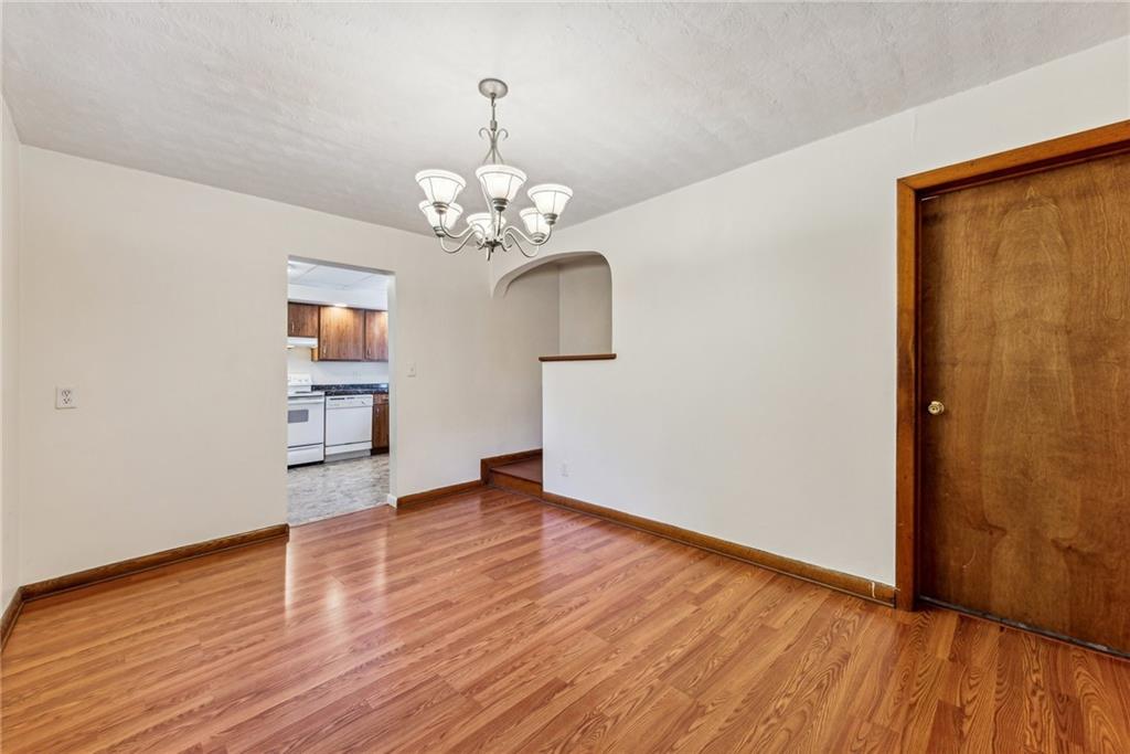 1746 Soap Hollow Road Johnstown, PA 15905 - Photo 9 of 30 a view of empty room with wooden floor and ceiling fan