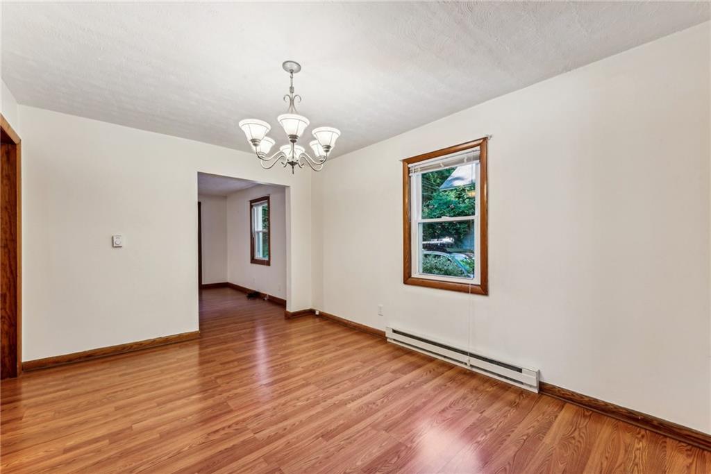1746 Soap Hollow Road Johnstown, PA 15905 - Photo 10 of 30 a view of an empty room with wooden floor and a window