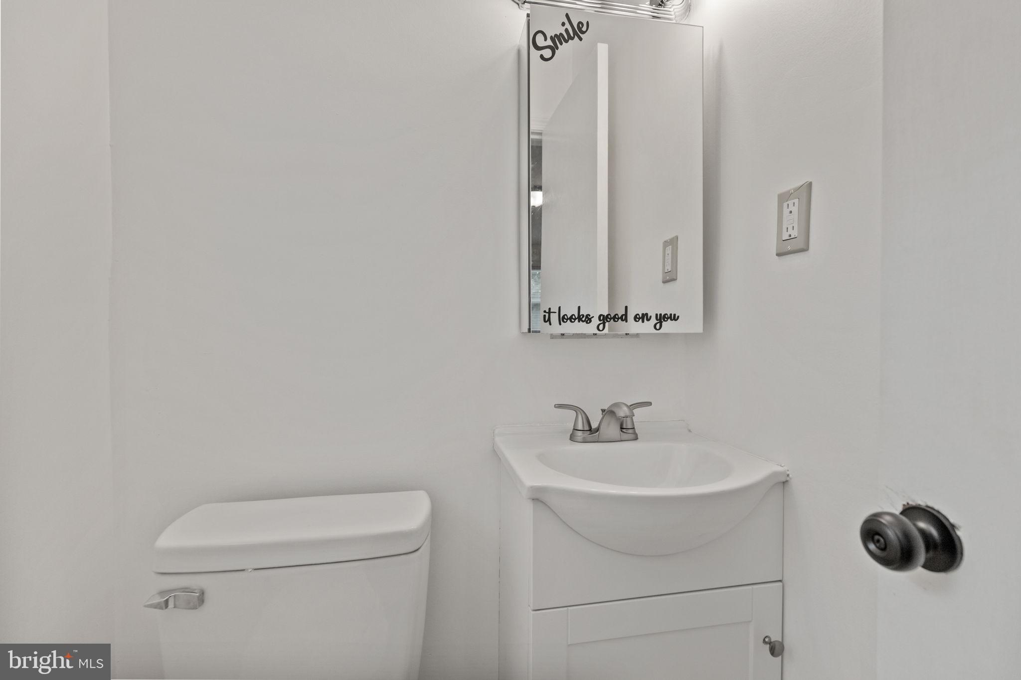 5508 Spruce Drive Clinton, MD 20735 - Photo 15 of 31 a bathroom with a sink a toilet and mirror