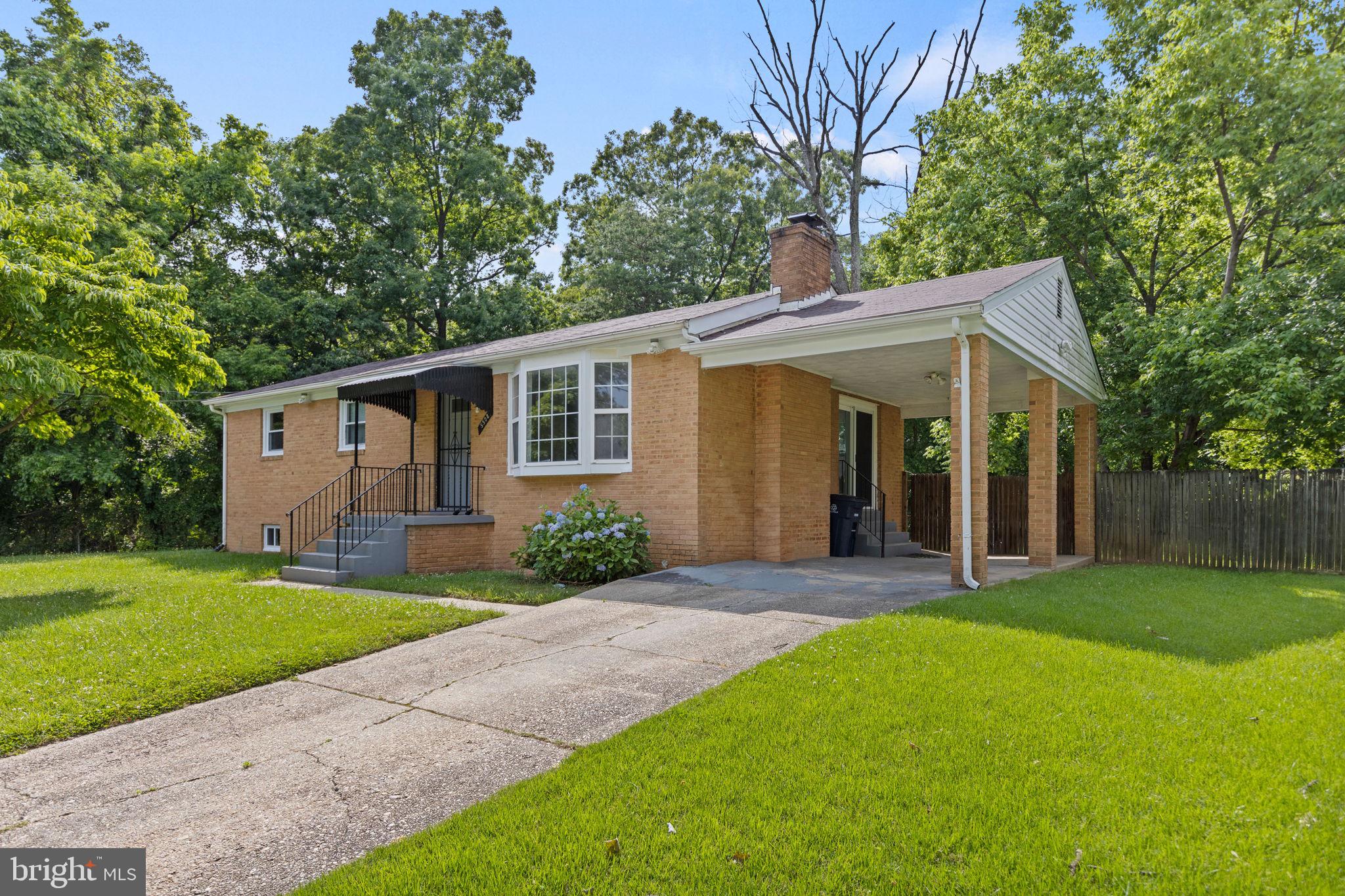 5508 Spruce Drive Clinton, MD 20735 - Photo 2 of 31 a view of a yard in front of a house with large tree