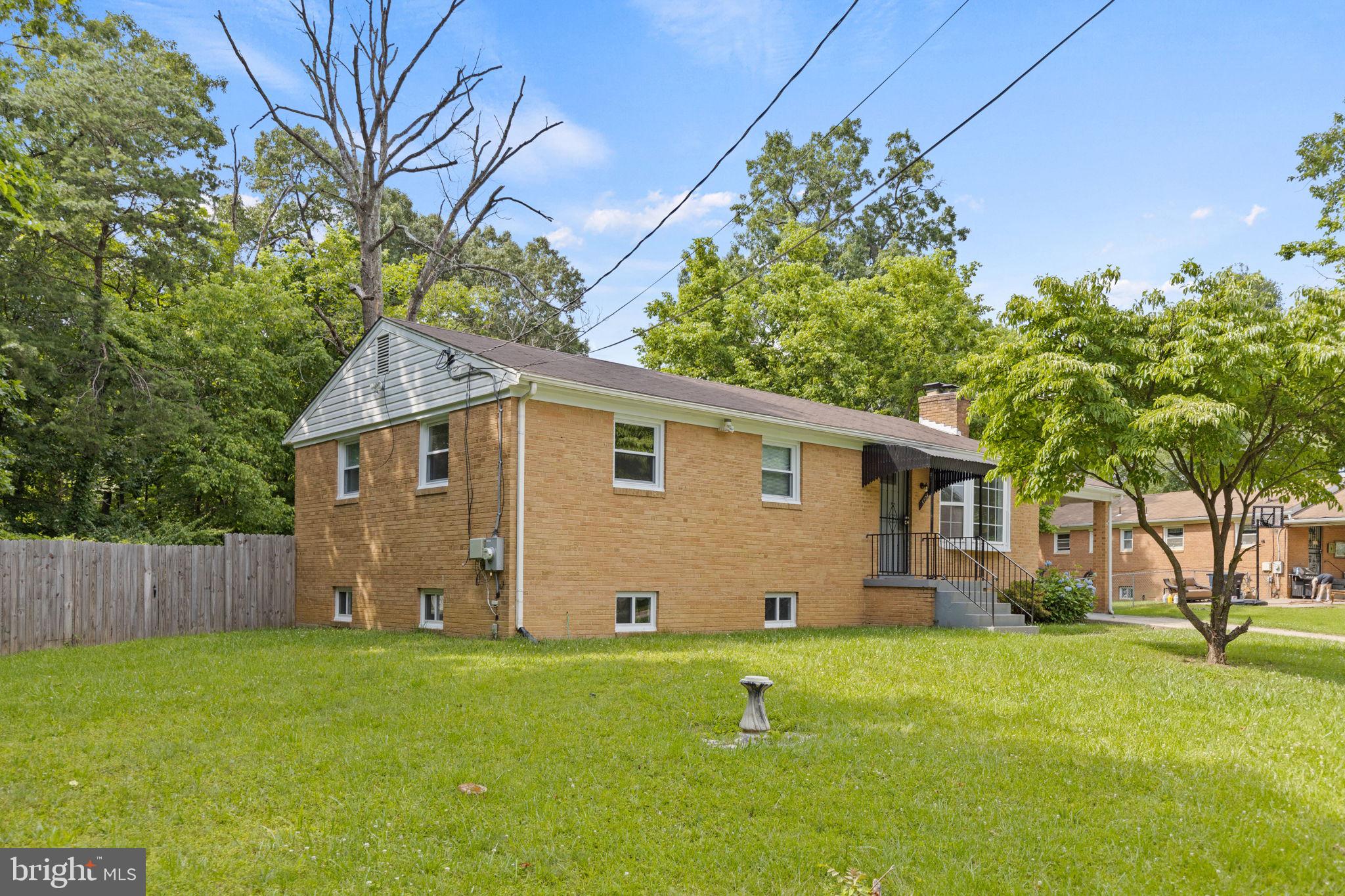 5508 Spruce Drive Clinton, MD 20735 - Photo 29 of 31 a view of a backyard with plants and large tree