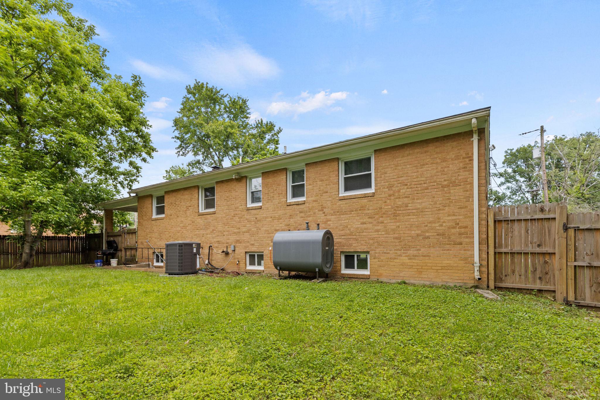 5508 Spruce Drive Clinton, MD 20735 - Photo 31 of 31 a front view of a house with a yard and garage