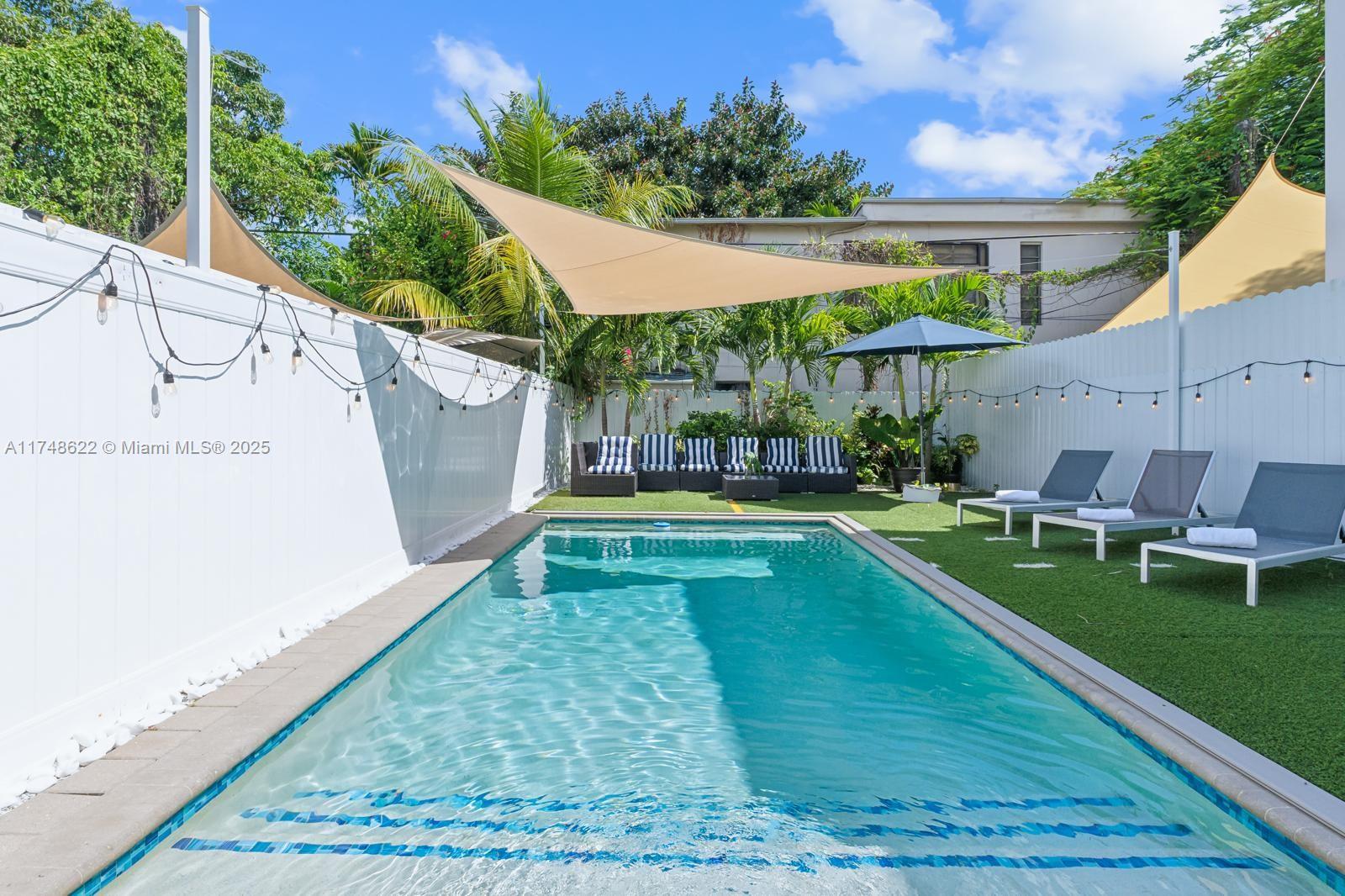 3572 Southwest 23rd Street, Unit 3572 Miami, FL 33145 - Photo 12 of 36 a view of a house with a yard