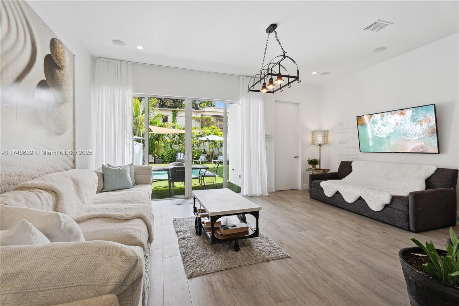 3572 Southwest 23rd Street, Unit 3572 Miami, FL 33145 - Photo 19 of 36 a living room with furniture and wooden floor