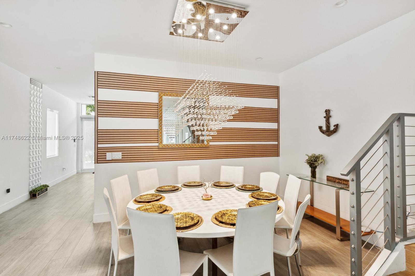 3572 Southwest 23rd Street, Unit 3572 Miami, FL 33145 - Photo 22 of 36 a view of a dining room with furniture and a large window