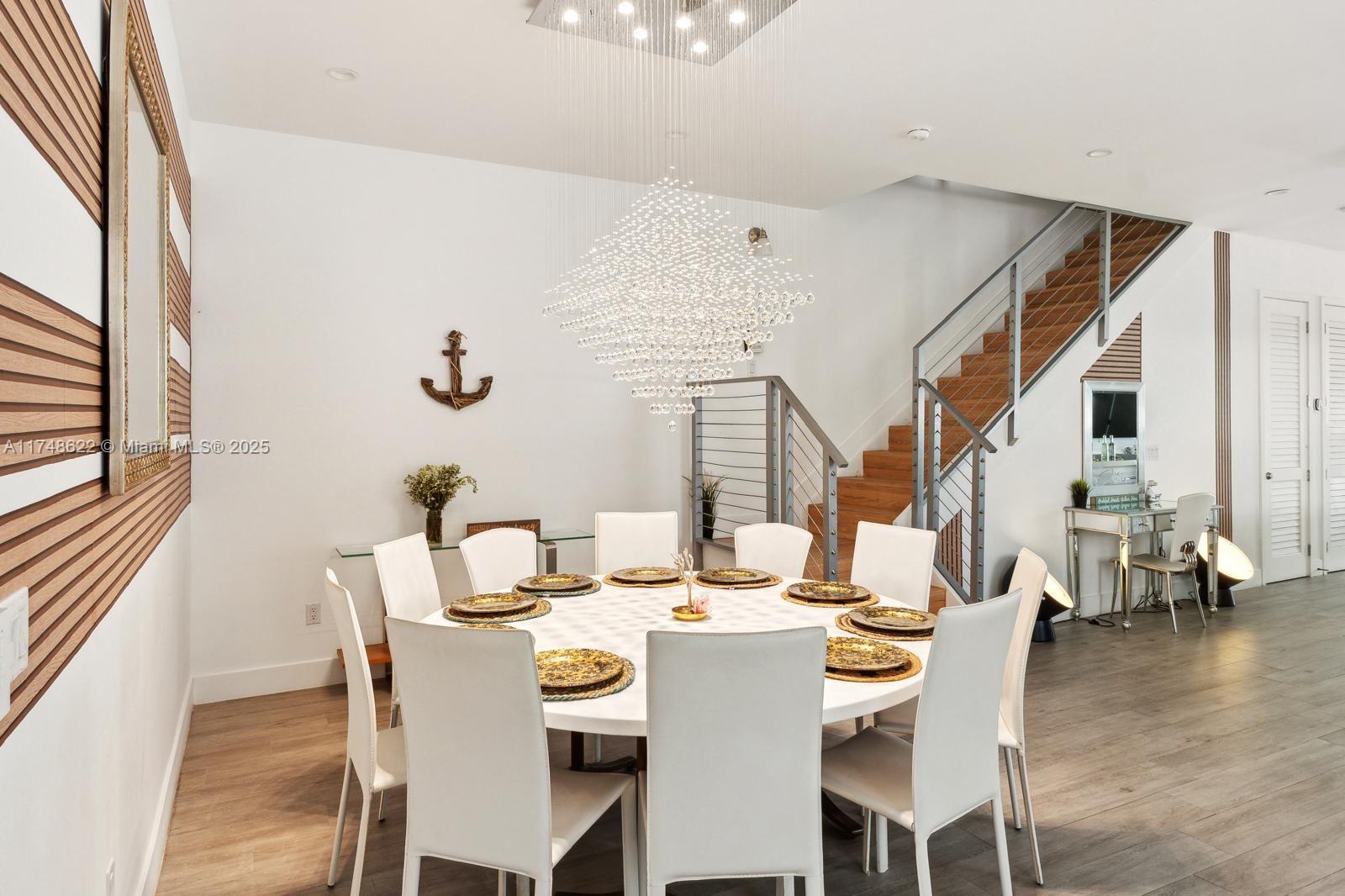3572 Southwest 23rd Street, Unit 3572 Miami, FL 33145 - Photo 32 of 36 a dining room with furniture and wooden floor