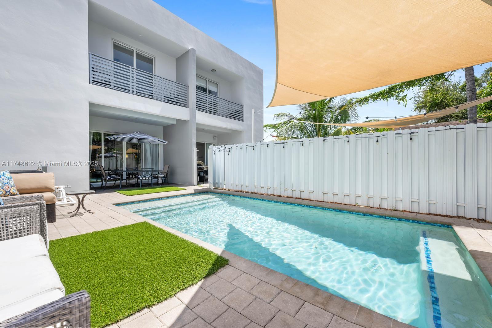 3572 Southwest 23rd Street, Unit 3572 Miami, FL 33145 - Photo 4 of 36 a view of a house with backyard and sitting area
