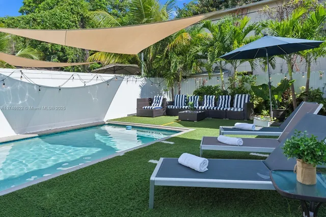 a backyard of a house with seating space