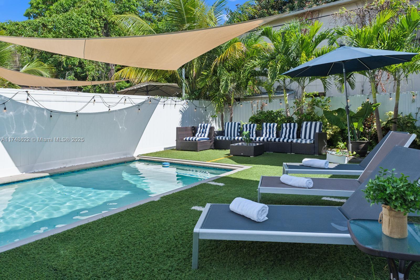 3572 Southwest 23rd Street, Unit 3572 Miami, FL 33145 - Photo 8 of 36 a backyard of a house with seating space