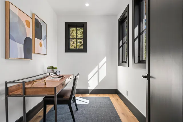 a view of a hallway with furniture and staircase