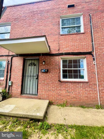 a room with pool table and windows