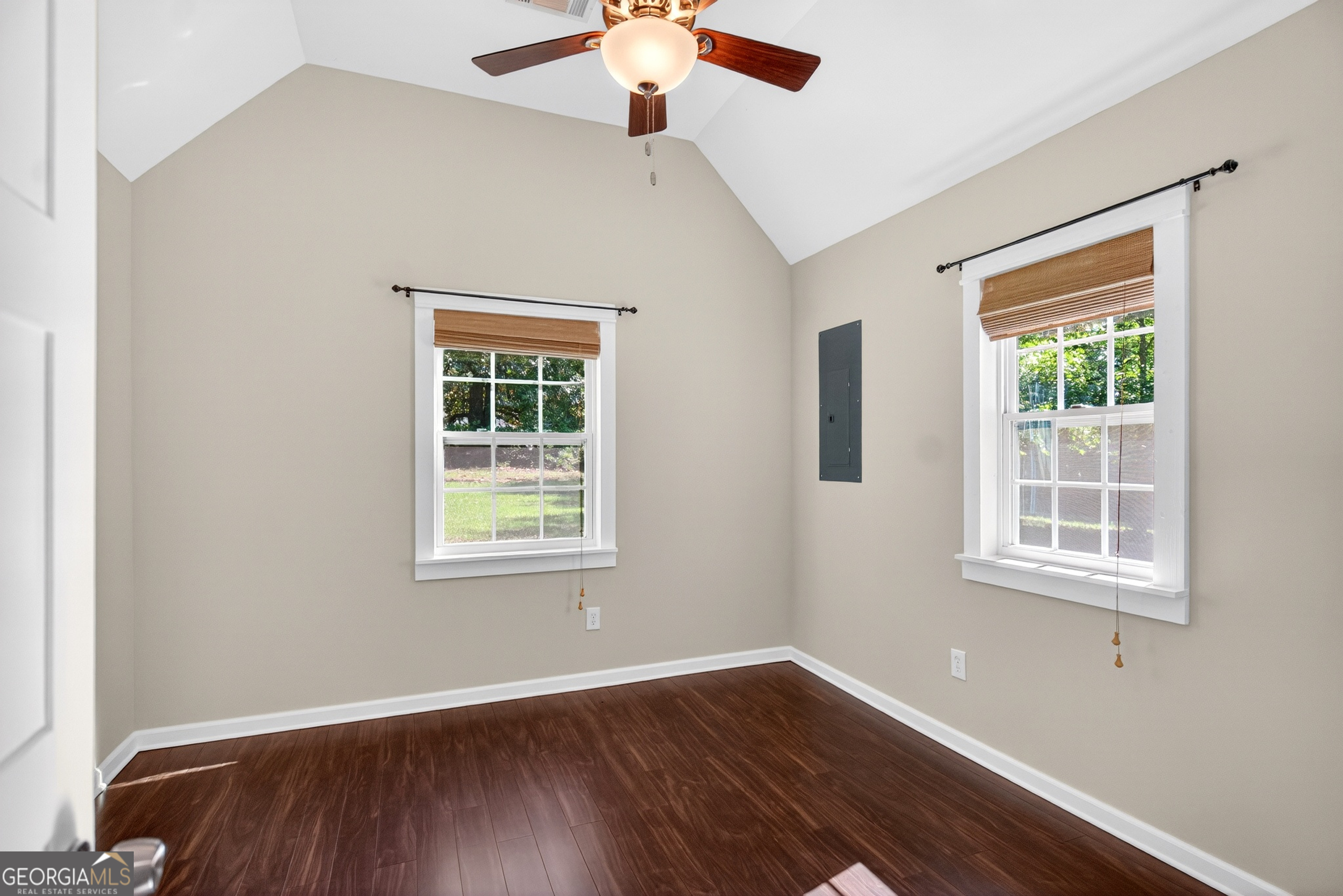 4656 Greenville Road LaGrange, GA 30241 - Photo 17 of 34 a view of an empty room with wooden floor and a window