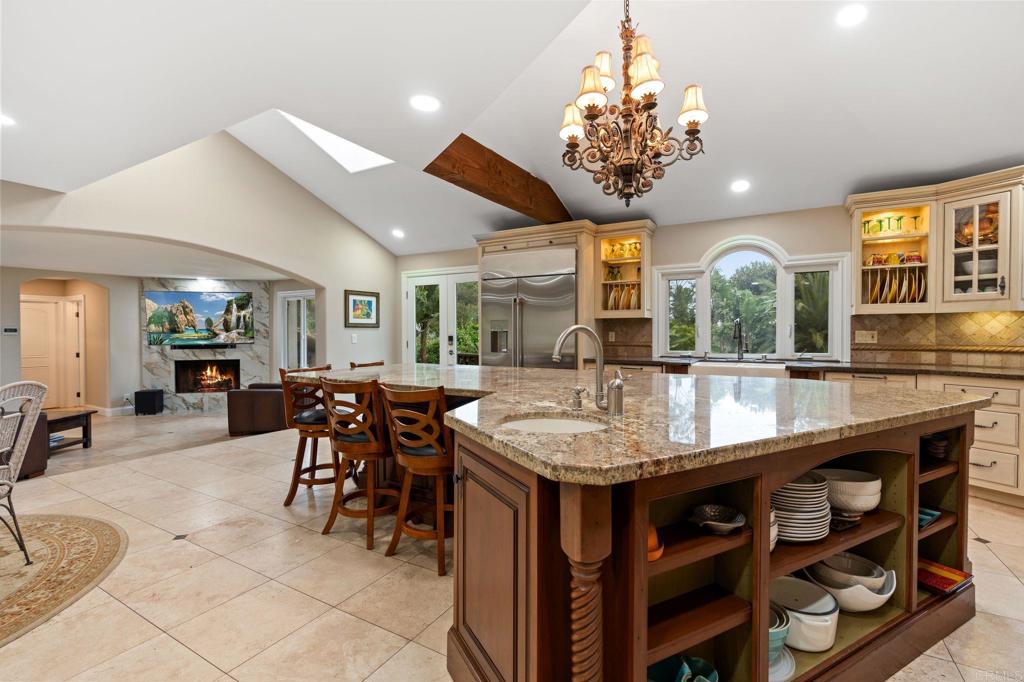 10845 Mystery Mountain Road Valley Center, CA 92082 - Photo 18 of 72 a view of a dining room with furniture and chandelier