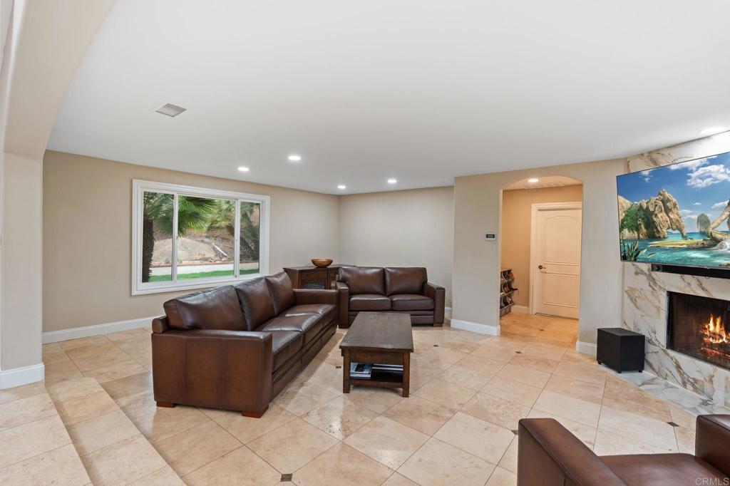10845 Mystery Mountain Road Valley Center, CA 92082 - Photo 20 of 72 a living room with furniture and a fireplace