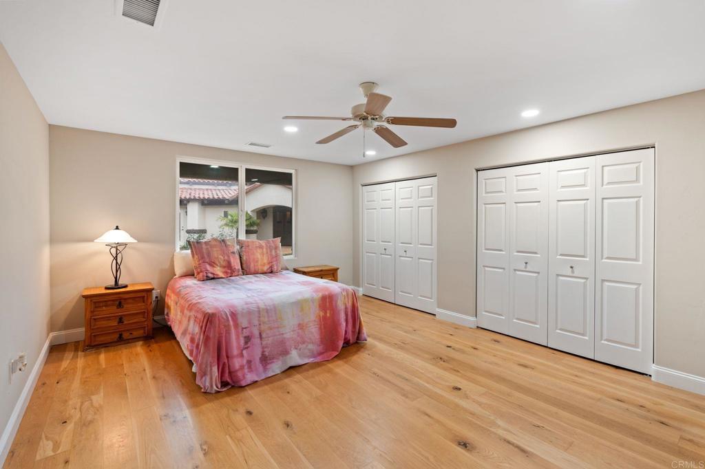 10845 Mystery Mountain Road Valley Center, CA 92082 - Photo 25 of 72 a bedroom with a bed and a ceiling fan