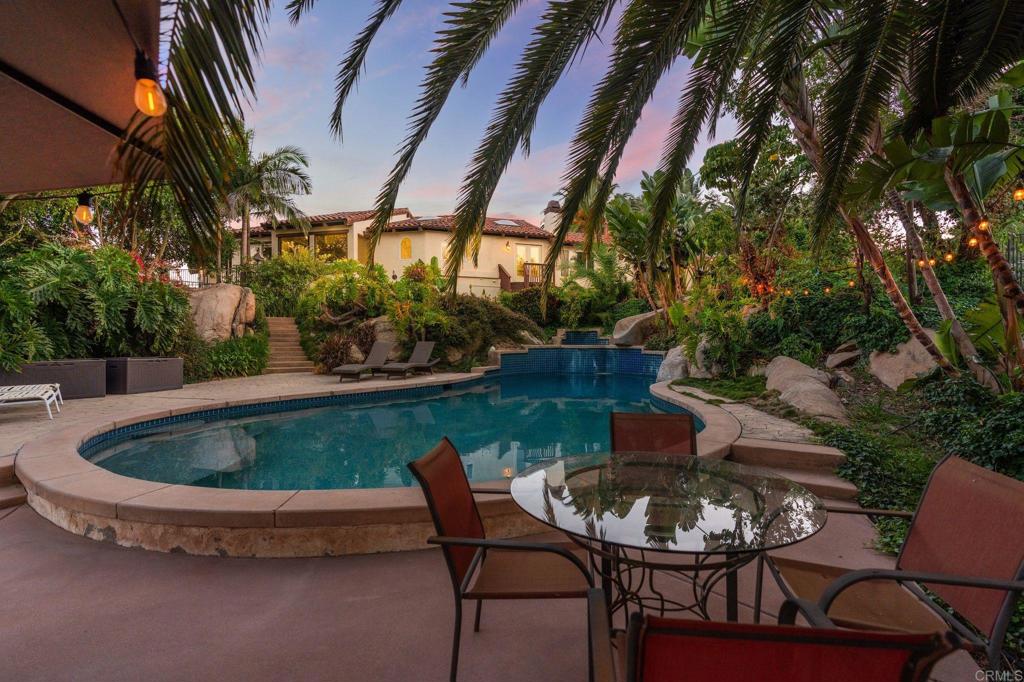10845 Mystery Mountain Road Valley Center, CA 92082 - Photo 40 of 72 a view of patio with table and chairs and potted plants