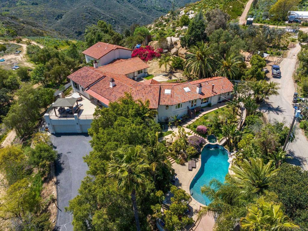 10845 Mystery Mountain Road Valley Center, CA 92082 - Photo 4 of 72 an aerial view of a house with a garden and swimming pool