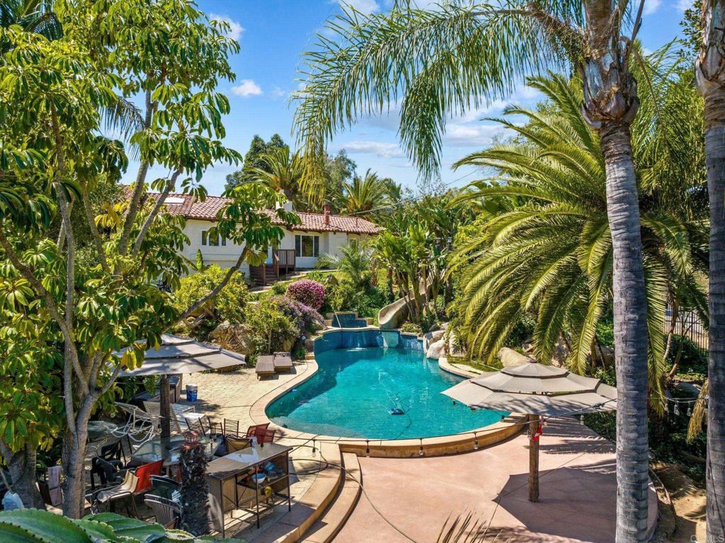10845 Mystery Mountain Road Valley Center, CA 92082 - Photo 49 of 72 a view of a swimming pool with outdoor seating and plants
