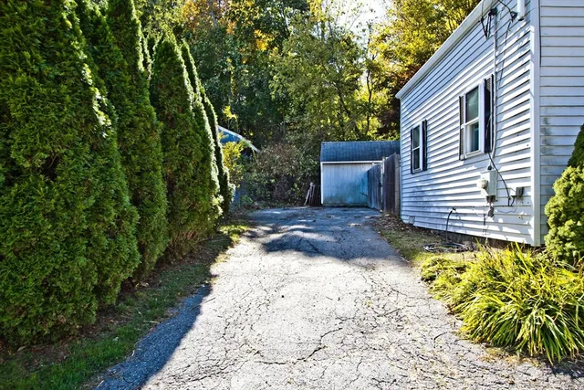 a view of a backyard with pathway