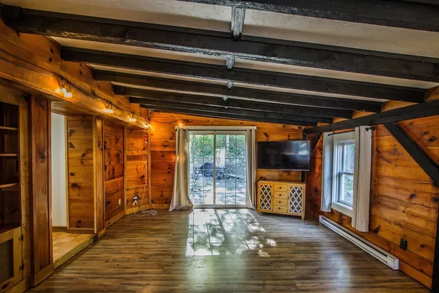 a view of an entryway door with wooden floor