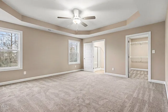 a view of an empty room and closet area