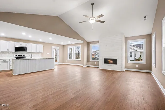 a kitchen with granite countertop kitchen island stainless steel appliances granite countertop a sink stove and cabinets