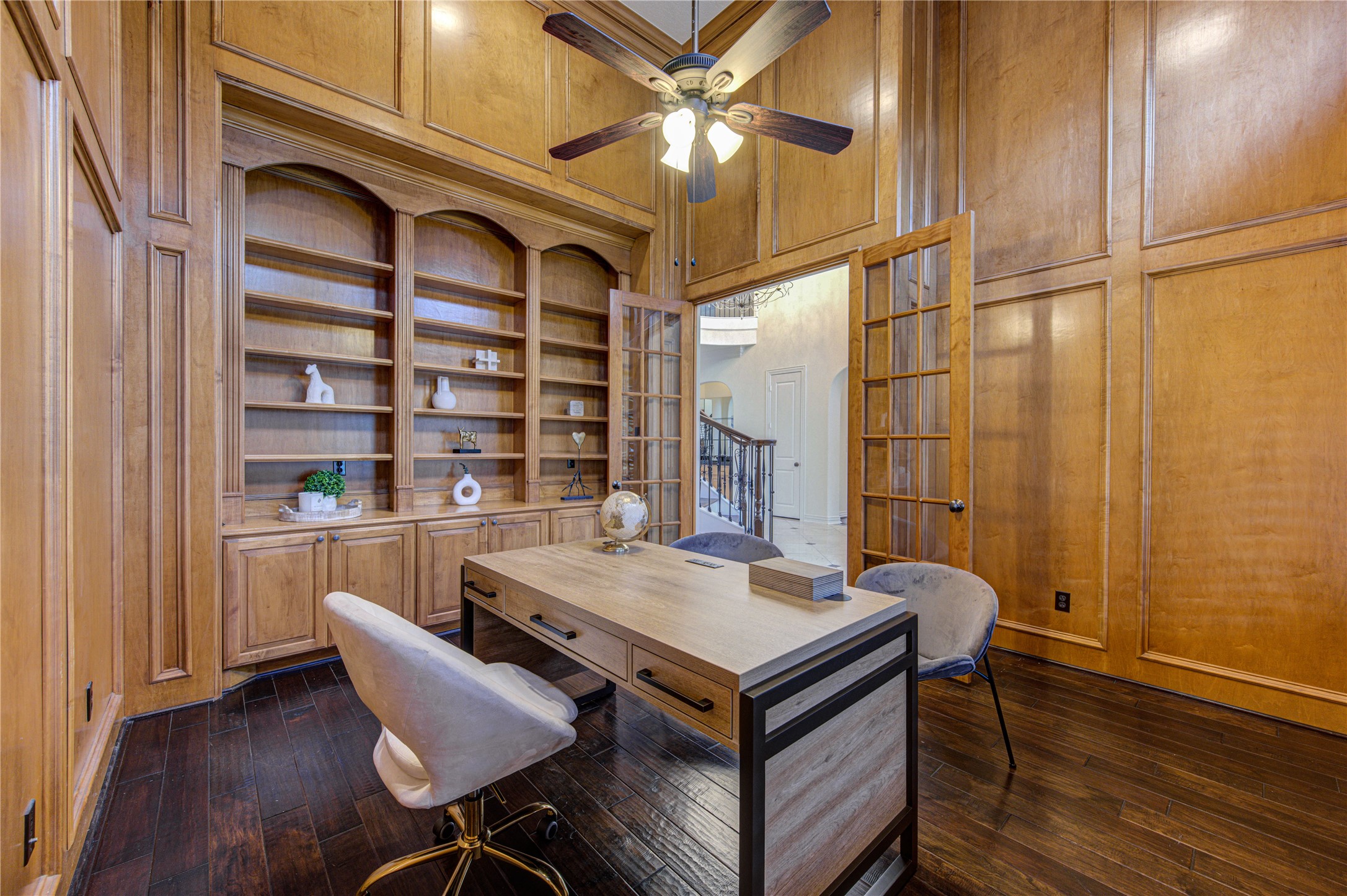 14014 Hampton Cove Drive Houston, TX 77077 - Photo 7 of 47 Studio with large custom paneling, dramatic double height ceilings, abundant natural light, and elegant shutters creating a bright and sophisticated workspace.